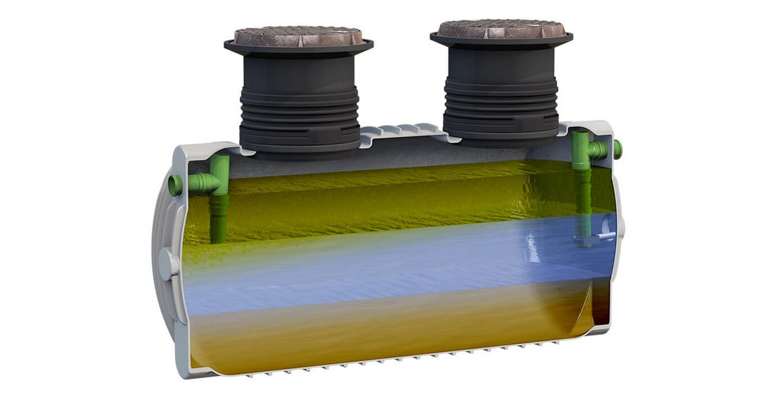 Image of a light grey and black Grease Arrestor 3000L tank, which has been sliced in half to view the grease separation process within the tank on a white background