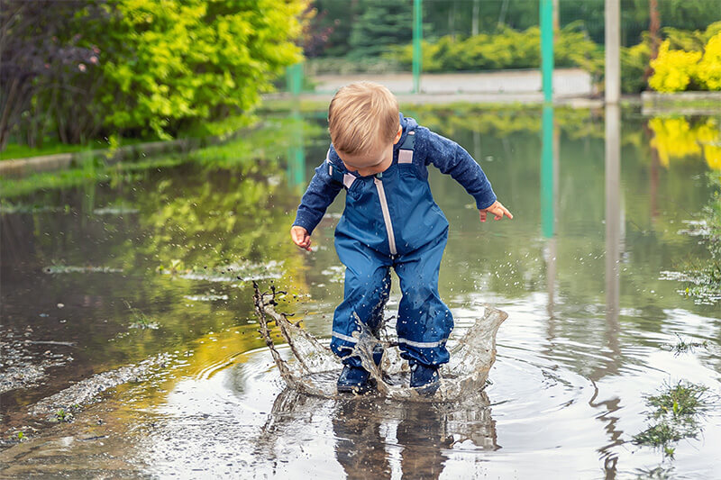 Image of a child playing in eco-friendly rainwater GARANTIA - Eco-Friendly Water Solutions for Sustainable Living